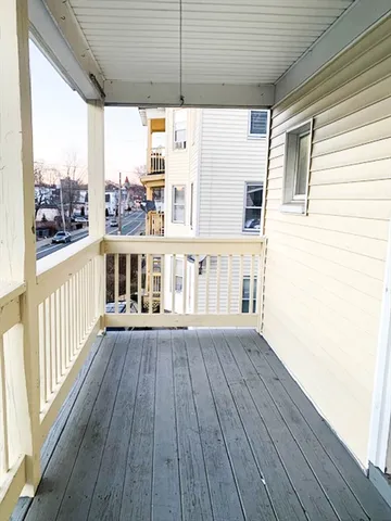 a view of a deck with wooden floor and roof