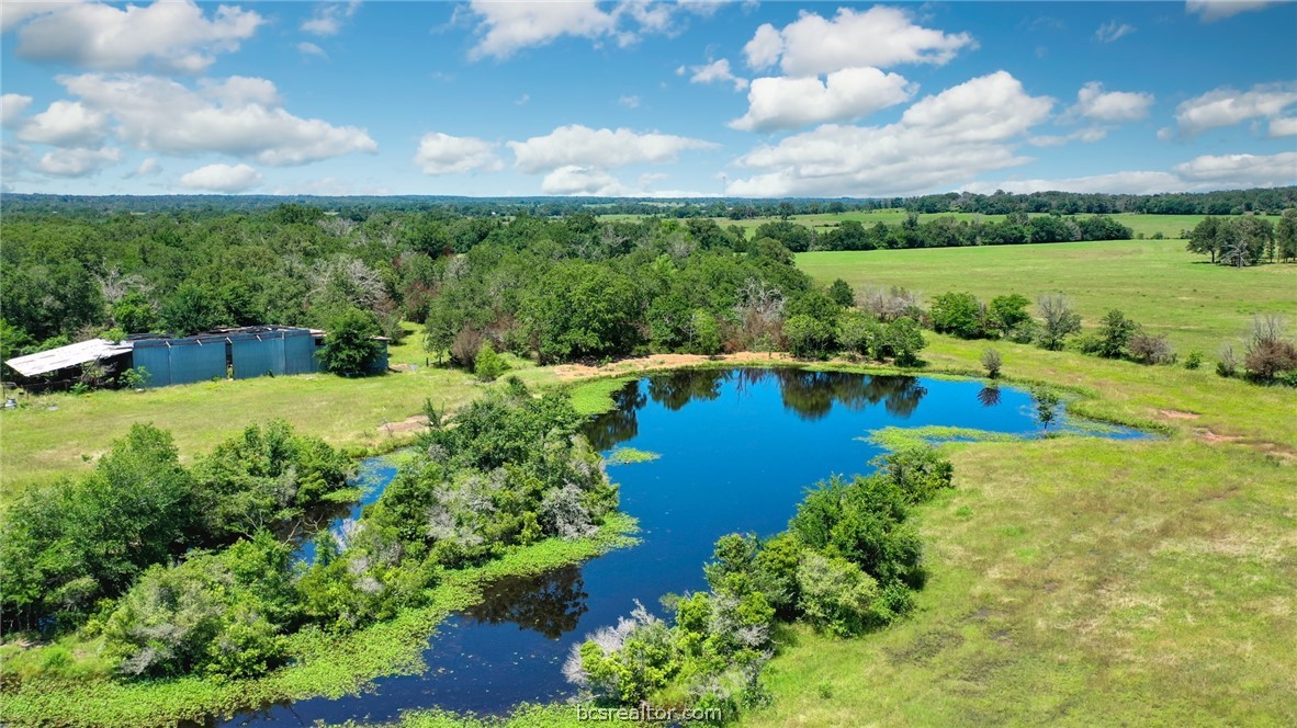 Tbd Mitch McMillan Road Franklin, TX 77856 - Photo 2 of 11 an aerial view of a house with a garden and lake view