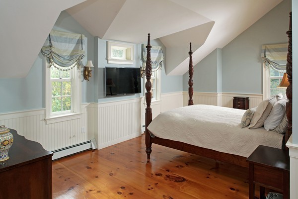 269 High Street Hingham, MA 02043 - Photo 17 of 29 a bed sitting in a bedroom next to a window