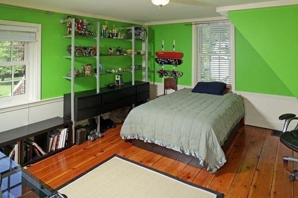 269 High Street Hingham, MA 02043 - Photo 19 of 29 a bed sitting in a bedroom next to a window