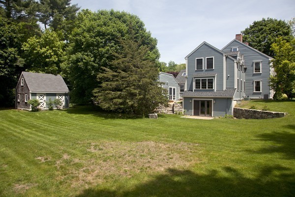 269 High Street Hingham, MA 02043 - Photo 26 of 29 a front view of a house with a garden