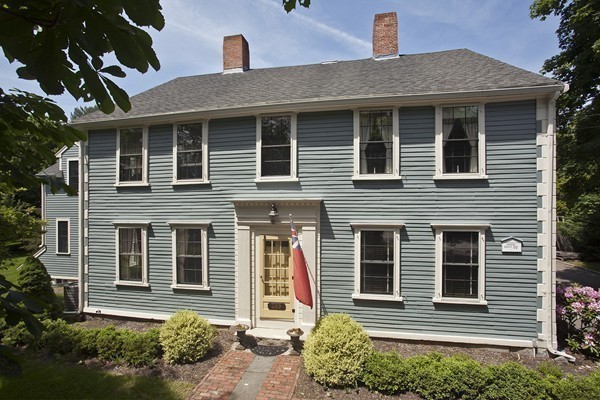 269 High Street Hingham, MA 02043 - Photo 3 of 29 a front view of a house with a yard