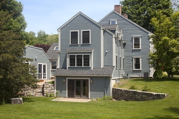 269 High Street Hingham, MA 02043 - Photo 5 of 29 a front view of a house with a yard