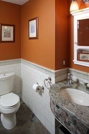 269 High Street Hingham, MA 02043 - Photo 9 of 29 a bathroom with a granite countertop toilet and a sink