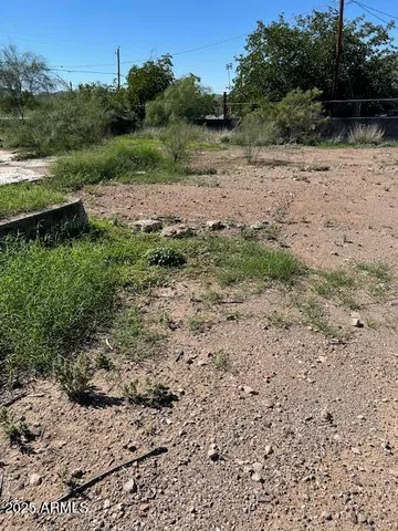 a view of lake with green field and trees
