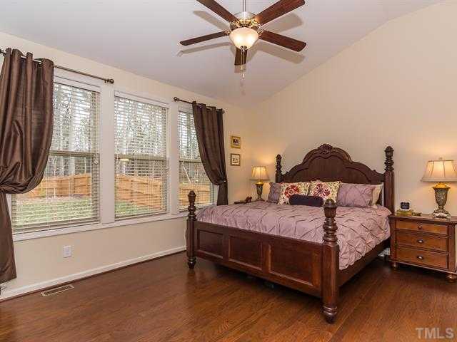 2903 Red Grape Drive Raleigh, NC 27607 - Photo 14 of 25 a bedroom with a bed and large window