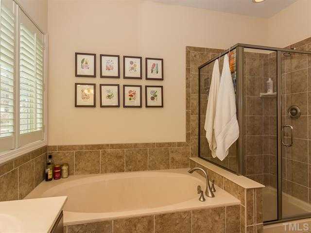 2903 Red Grape Drive Raleigh, NC 27607 - Photo 16 of 25 a bathroom with a bathtub and shower