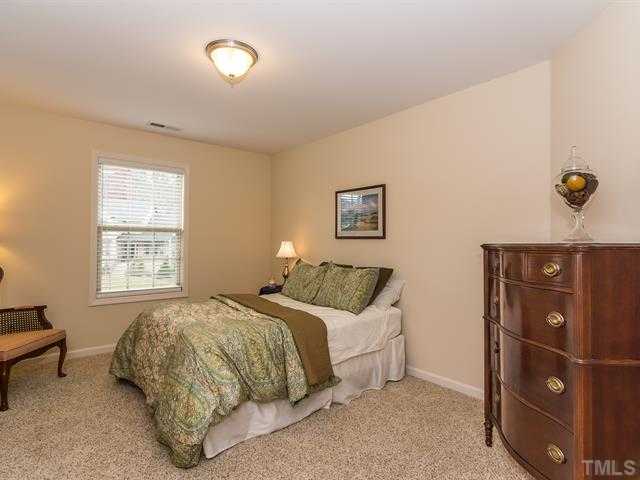 2903 Red Grape Drive Raleigh, NC 27607 - Photo 18 of 25 a bedroom with a bed and a window