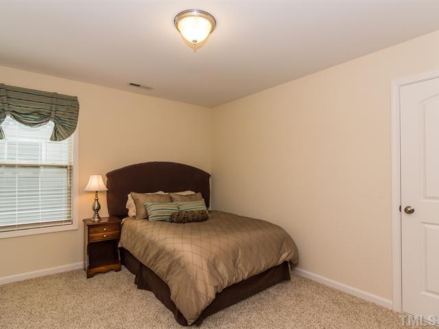 2903 Red Grape Drive Raleigh, NC 27607 - Photo 19 of 25 a bedroom with a bed and window