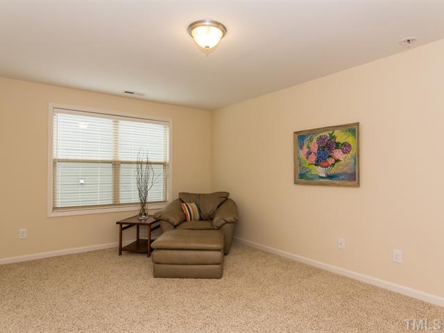 2903 Red Grape Drive Raleigh, NC 27607 - Photo 20 of 25 a living room with furniture and a window