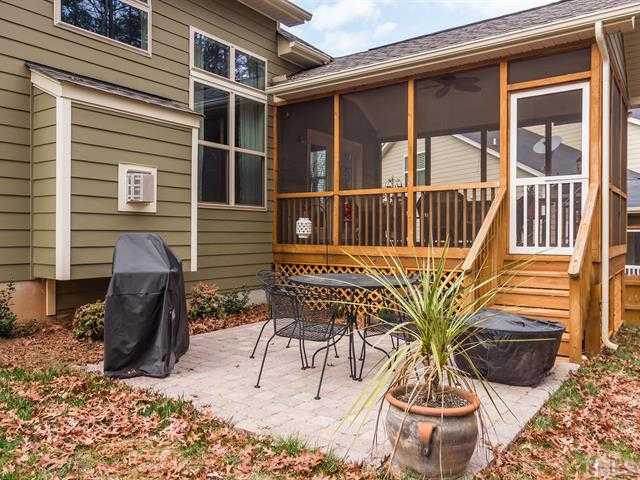 2903 Red Grape Drive Raleigh, NC 27607 - Photo 24 of 25 a view of a patio with table and chairs and wooden floor