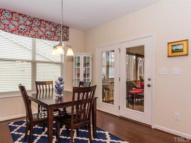 2903 Red Grape Drive Raleigh, NC 27607 - Photo 9 of 25 a view of a dining room with furniture and wooden floor