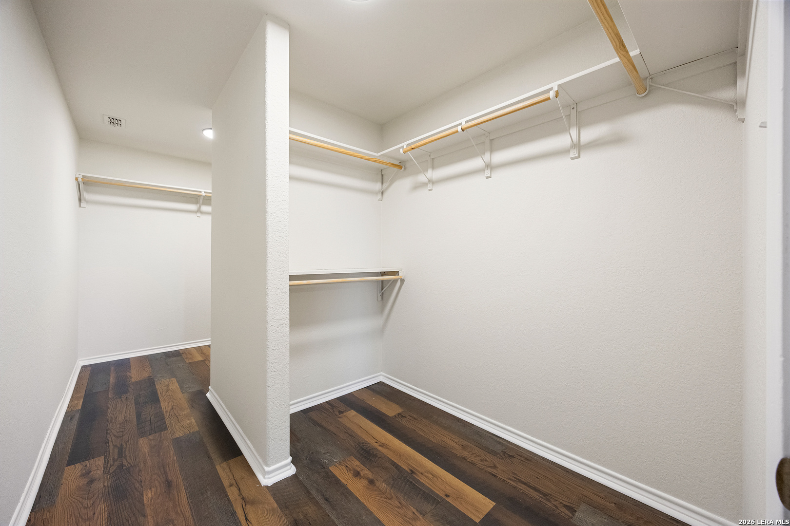 18181 Senior Road Von Ormy, TX 78073 - Photo 27 of 46 a view of walk in closet with wooden floor