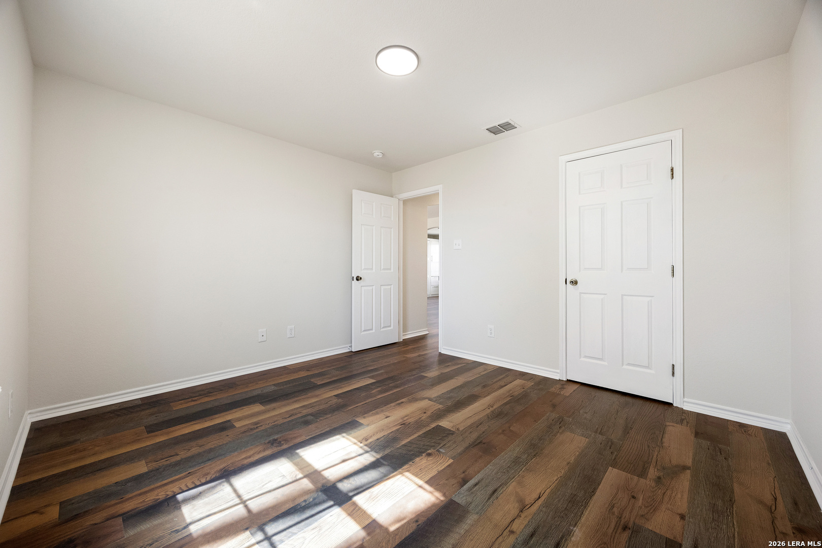 18181 Senior Road Von Ormy, TX 78073 - Photo 30 of 46 a view of room with window and hardwood floor