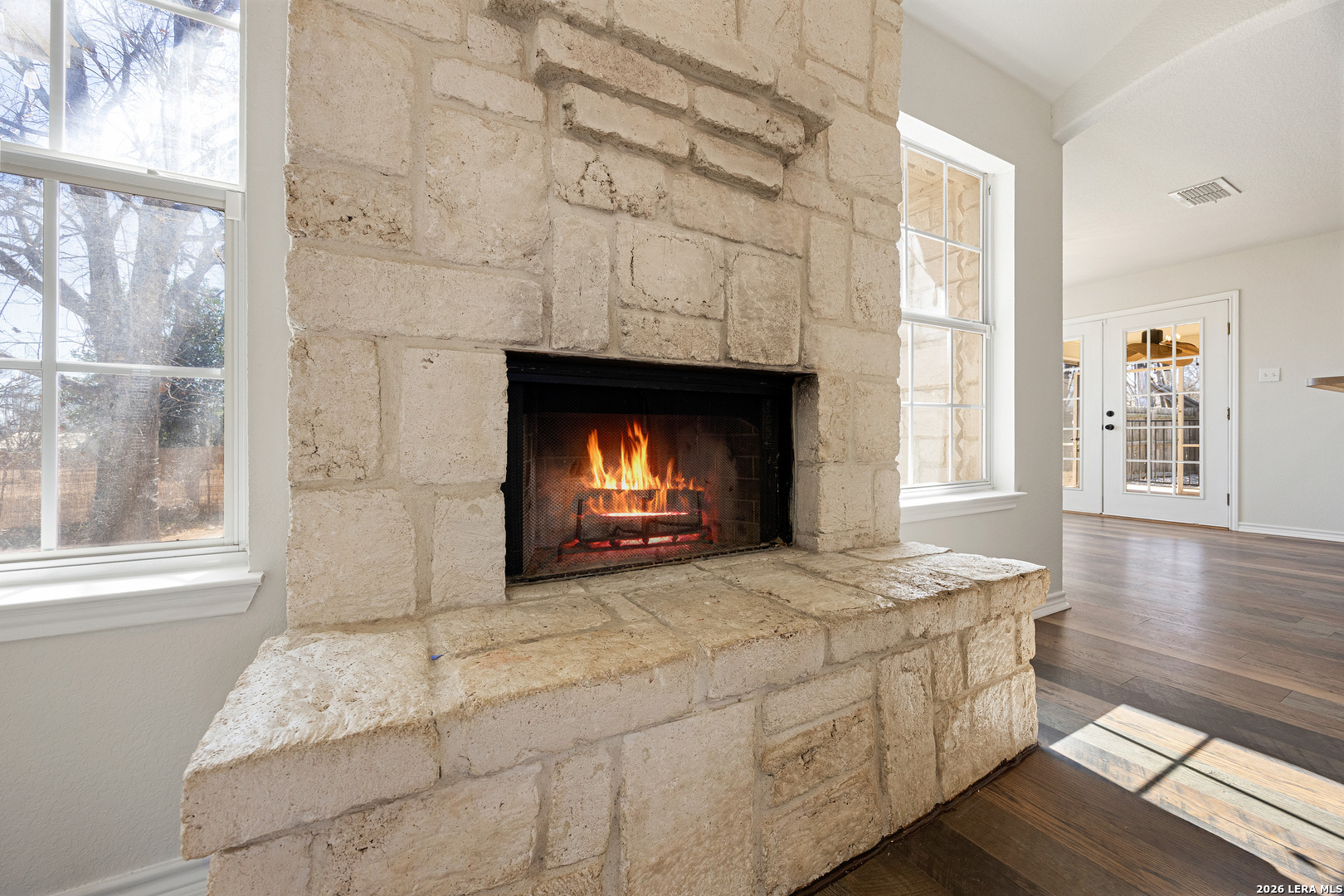 18181 Senior Road Von Ormy, TX 78073 - Photo 33 of 46 a living room with furniture window and a fireplace