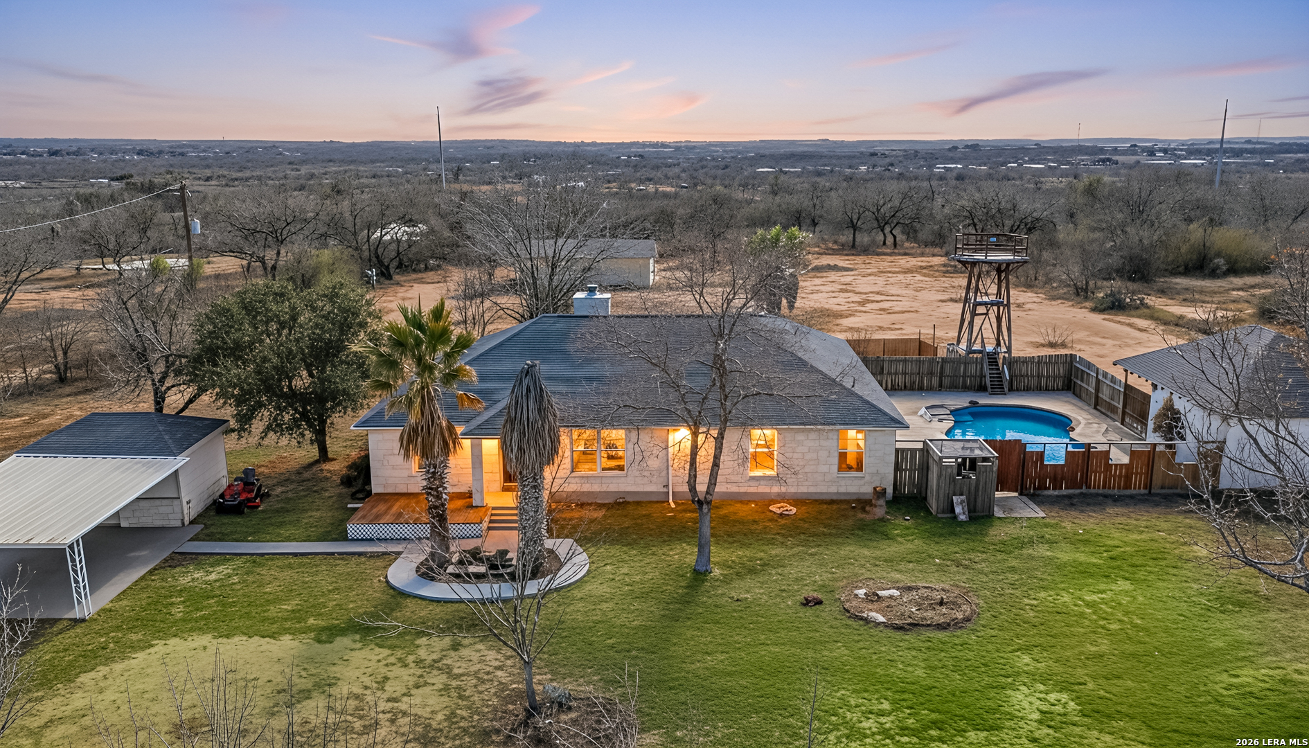 18181 Senior Road Von Ormy, TX 78073 - Photo 36 of 46 a view of a swimming pool with a yard