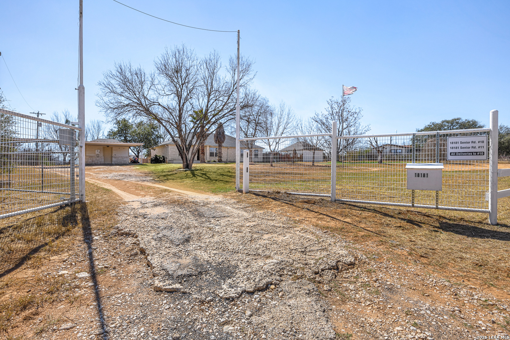 18181 Senior Road Von Ormy, TX 78073 - Photo 37 of 46 a view of a yard with wooden fence