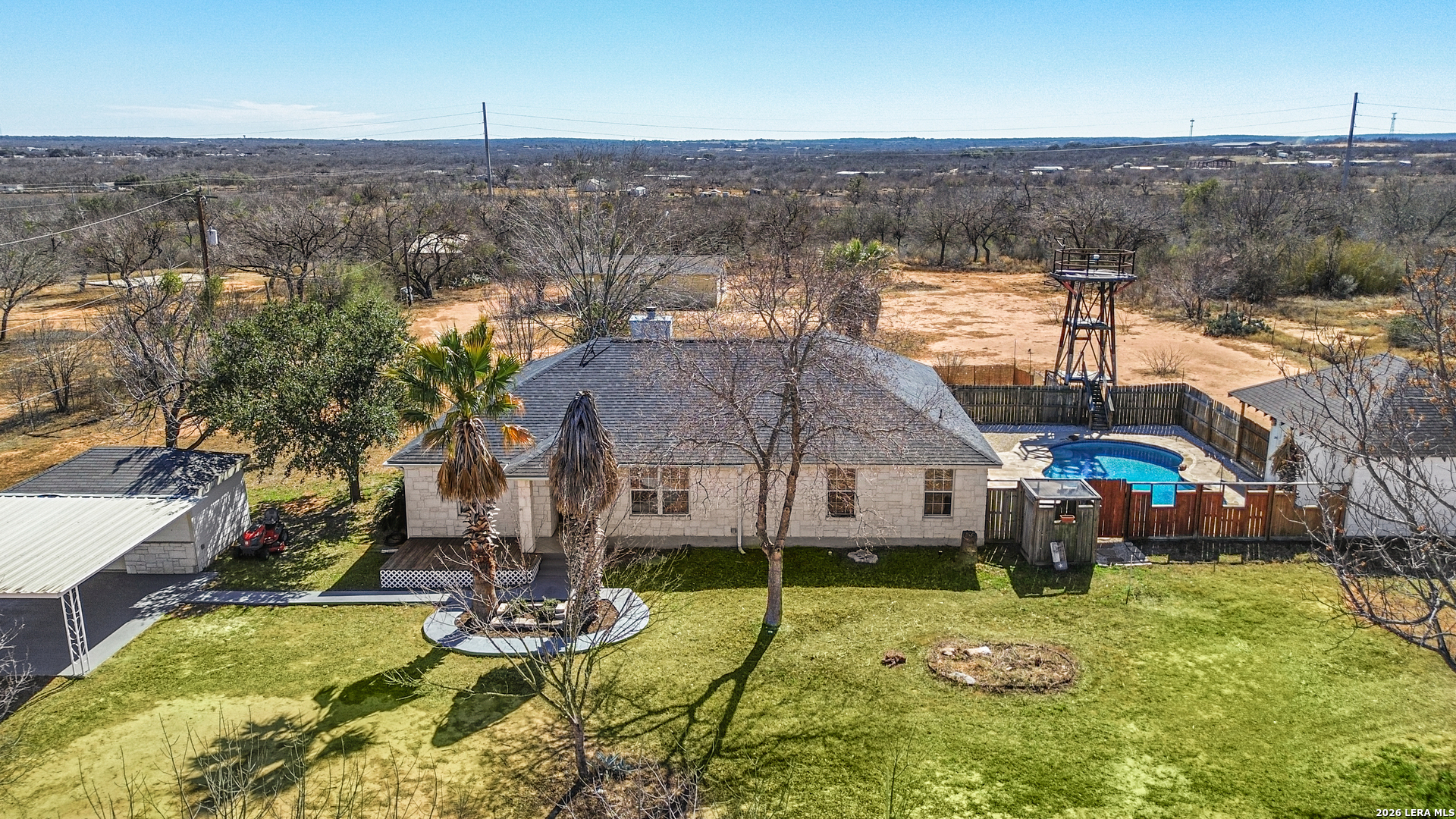 18181 Senior Road Von Ormy, TX 78073 - Photo 39 of 46 an aerial view of a house with swimming pool and lake view