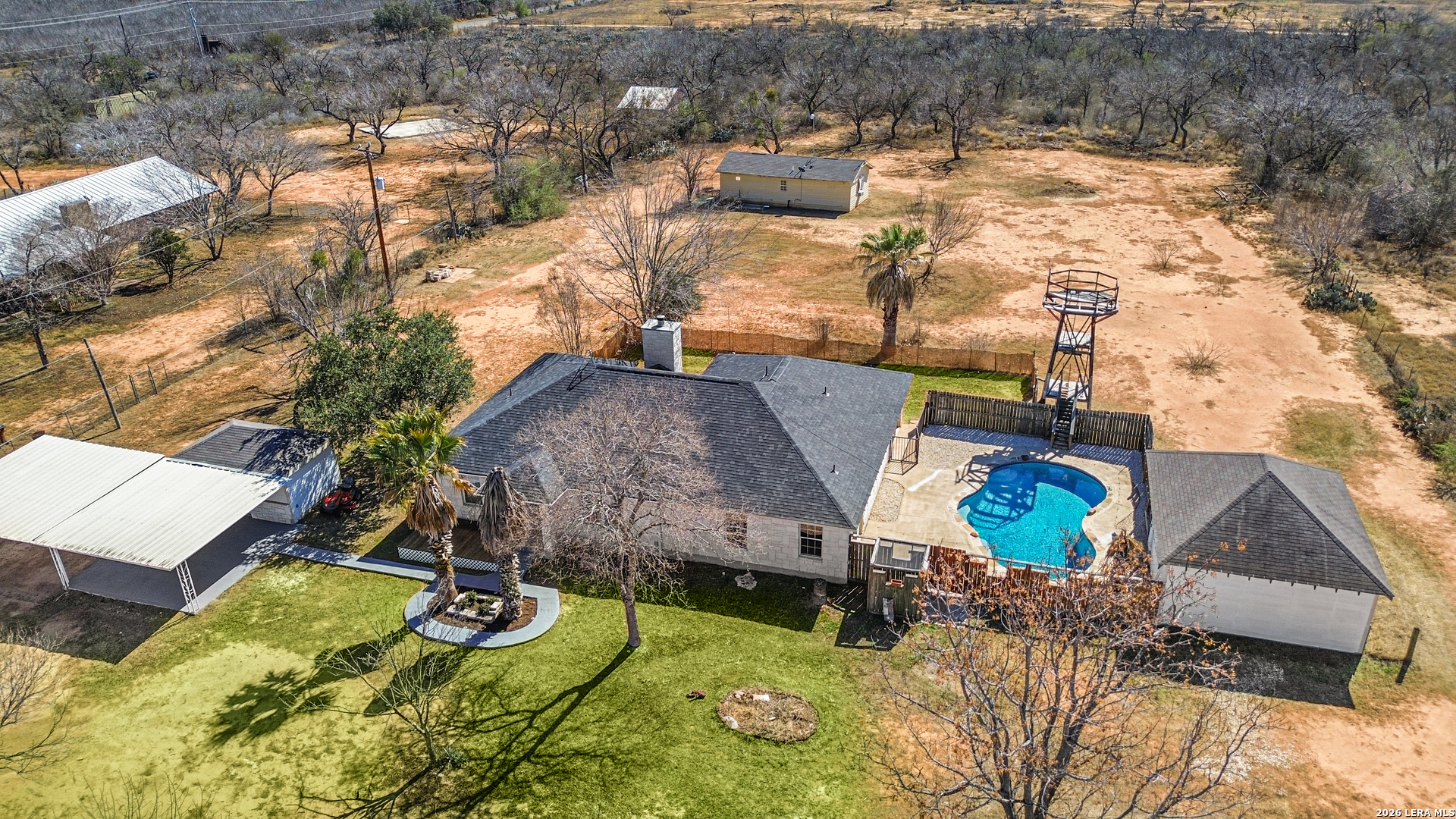 18181 Senior Road Von Ormy, TX 78073 - Photo 40 of 46 a aerial view of a house with swimming pool and large trees