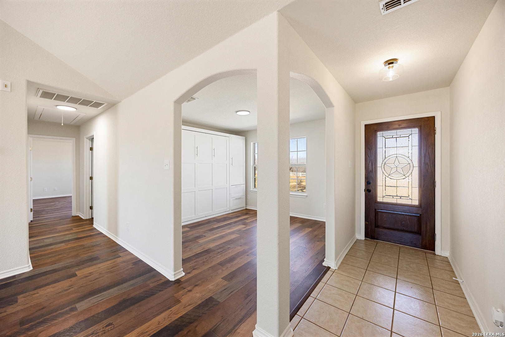18181 Senior Road Von Ormy, TX 78073 - Photo 7 of 46 a view of a hallway with wooden floor and closet