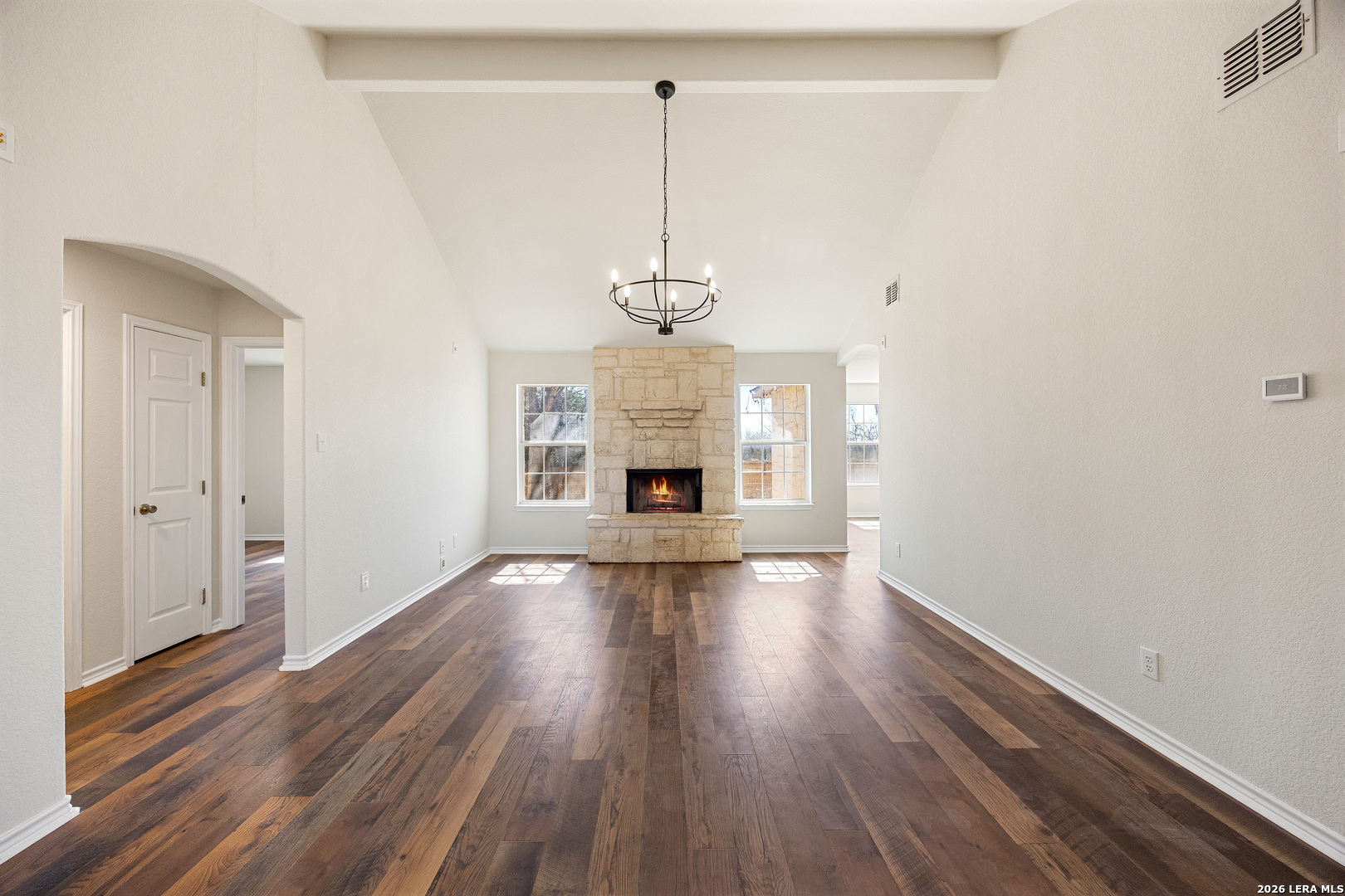 18181 Senior Road Von Ormy, TX 78073 - Photo 10 of 46 a view of a room with wooden floor fireplace and windows