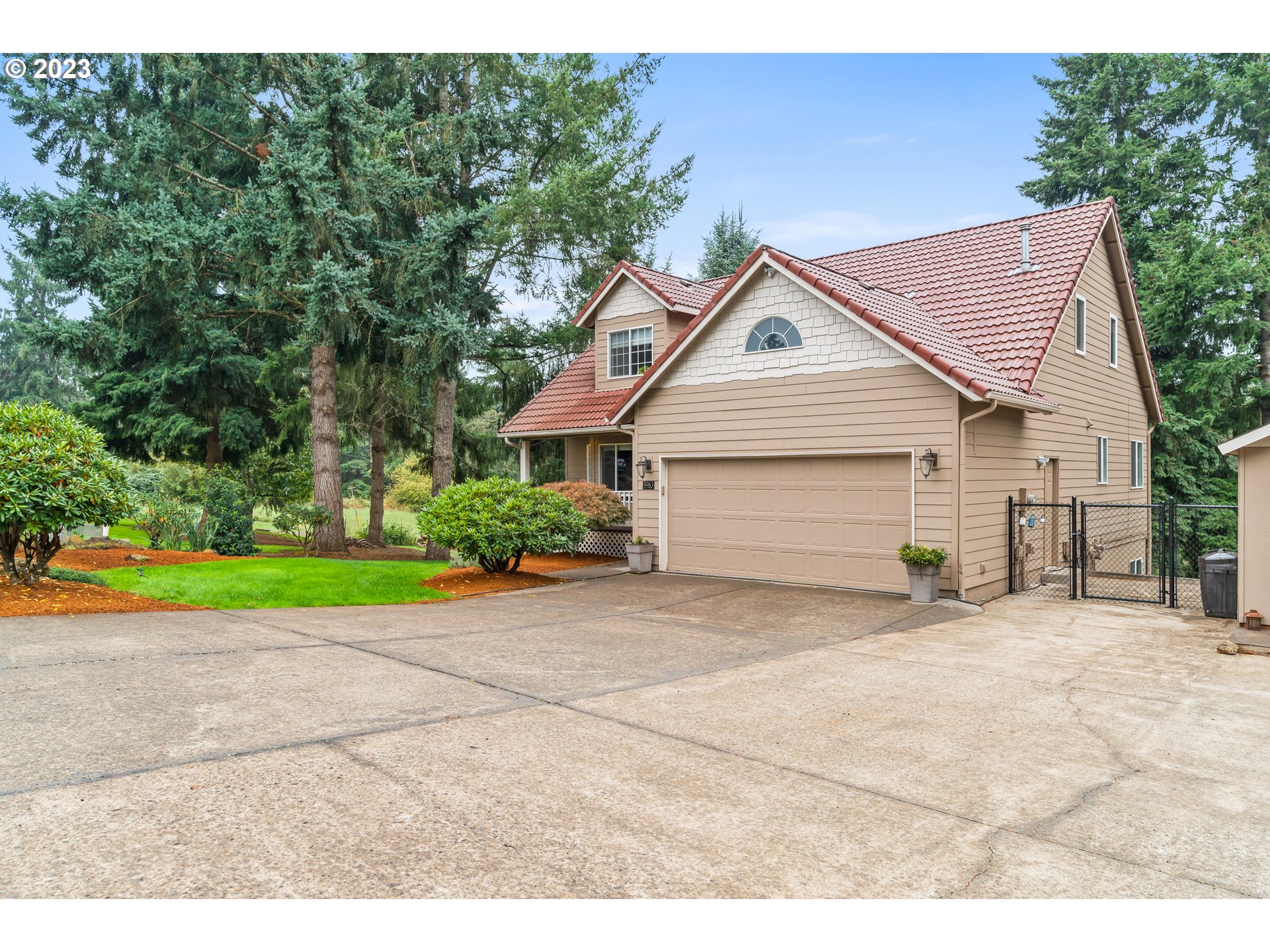 5963 Timber Ridge Drive Southeast Salem, OR 97317 - Photo 1 of 39 a view of a house with a yard and swimming pool