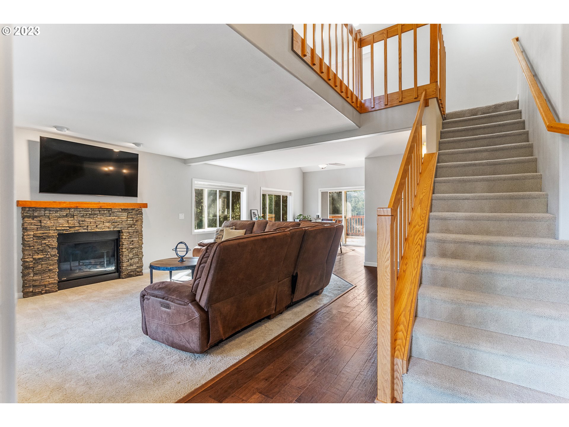 5963 Timber Ridge Drive Southeast Salem, OR 97317 - Photo 15 of 39 a living room with furniture and a fireplace