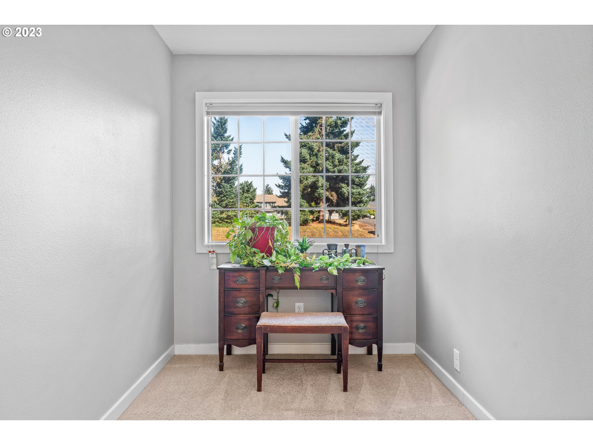 5963 Timber Ridge Drive Southeast Salem, OR 97317 - Photo 26 of 39 a chair and table in a room with a window