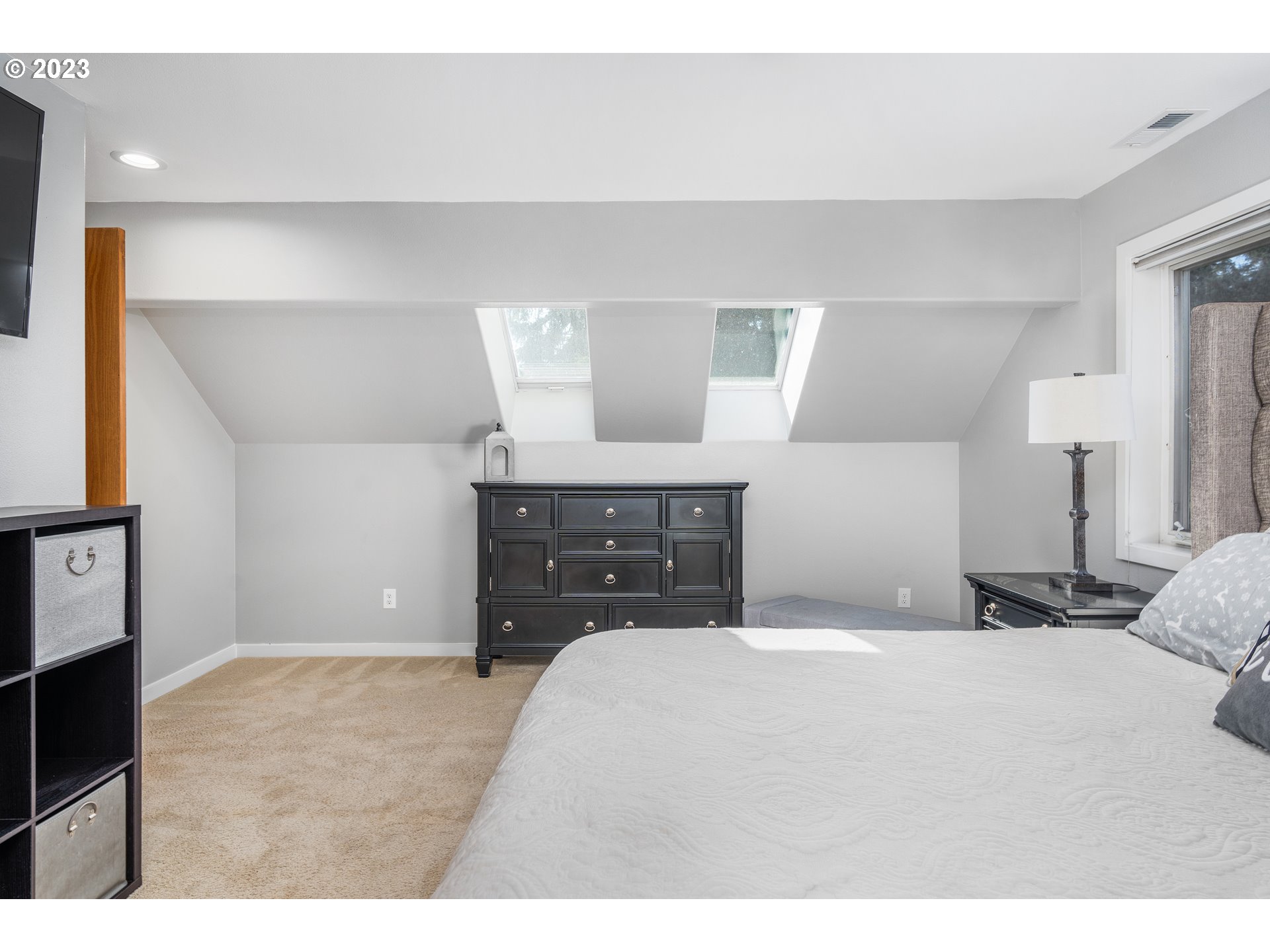 5963 Timber Ridge Drive Southeast Salem, OR 97317 - Photo 29 of 39 a bedroom with a bed and a cabinets