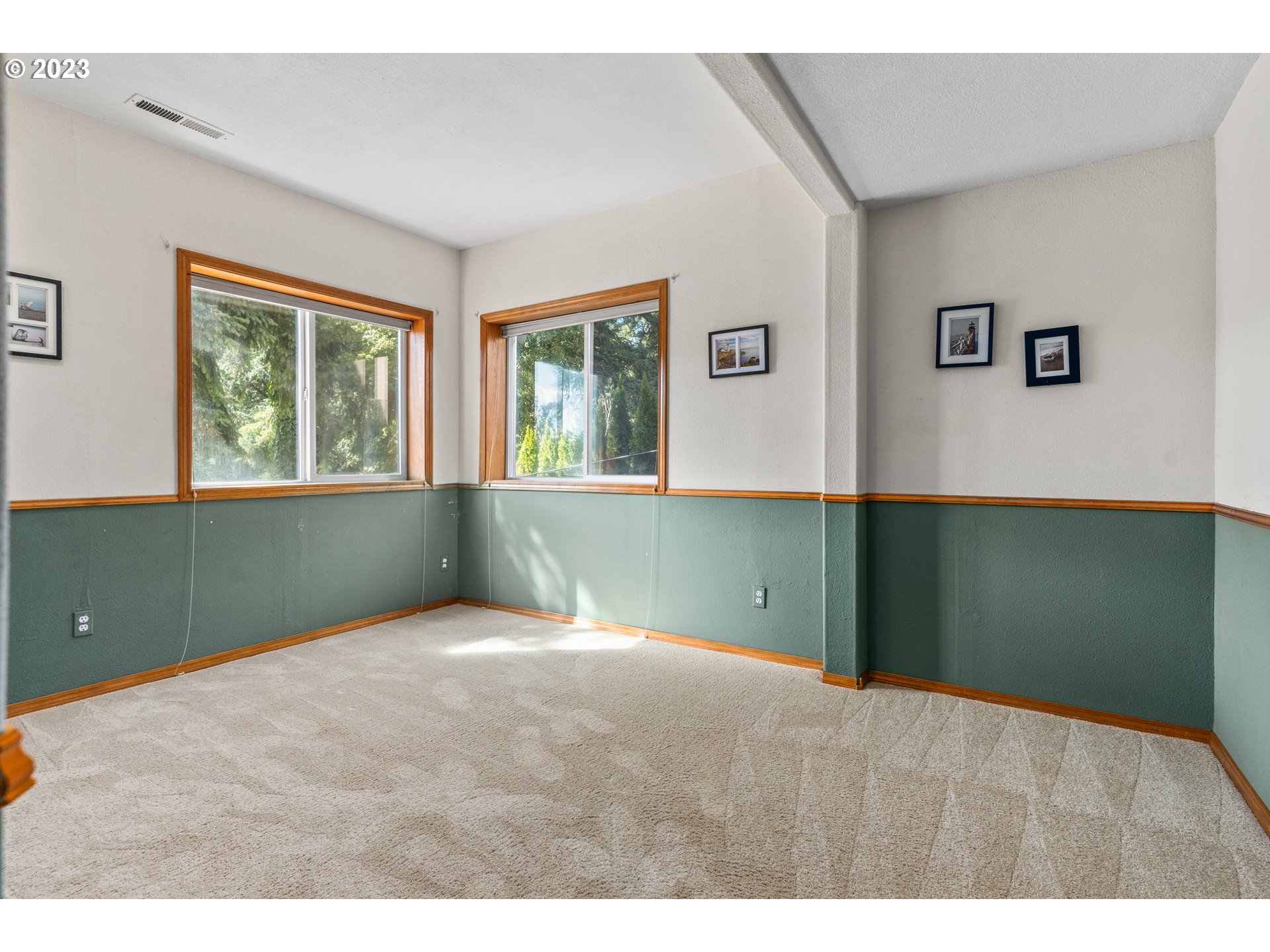 5963 Timber Ridge Drive Southeast Salem, OR 97317 - Photo 37 of 39 a bedroom with window and hardwood floor