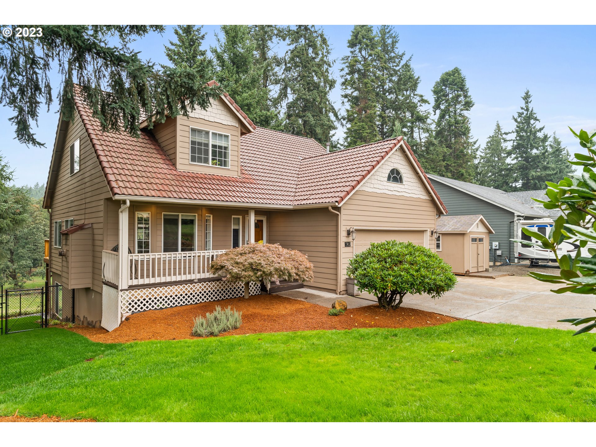 5963 Timber Ridge Drive Southeast Salem, OR 97317 - Photo 5 of 39 a front view of a house with a garden and yard