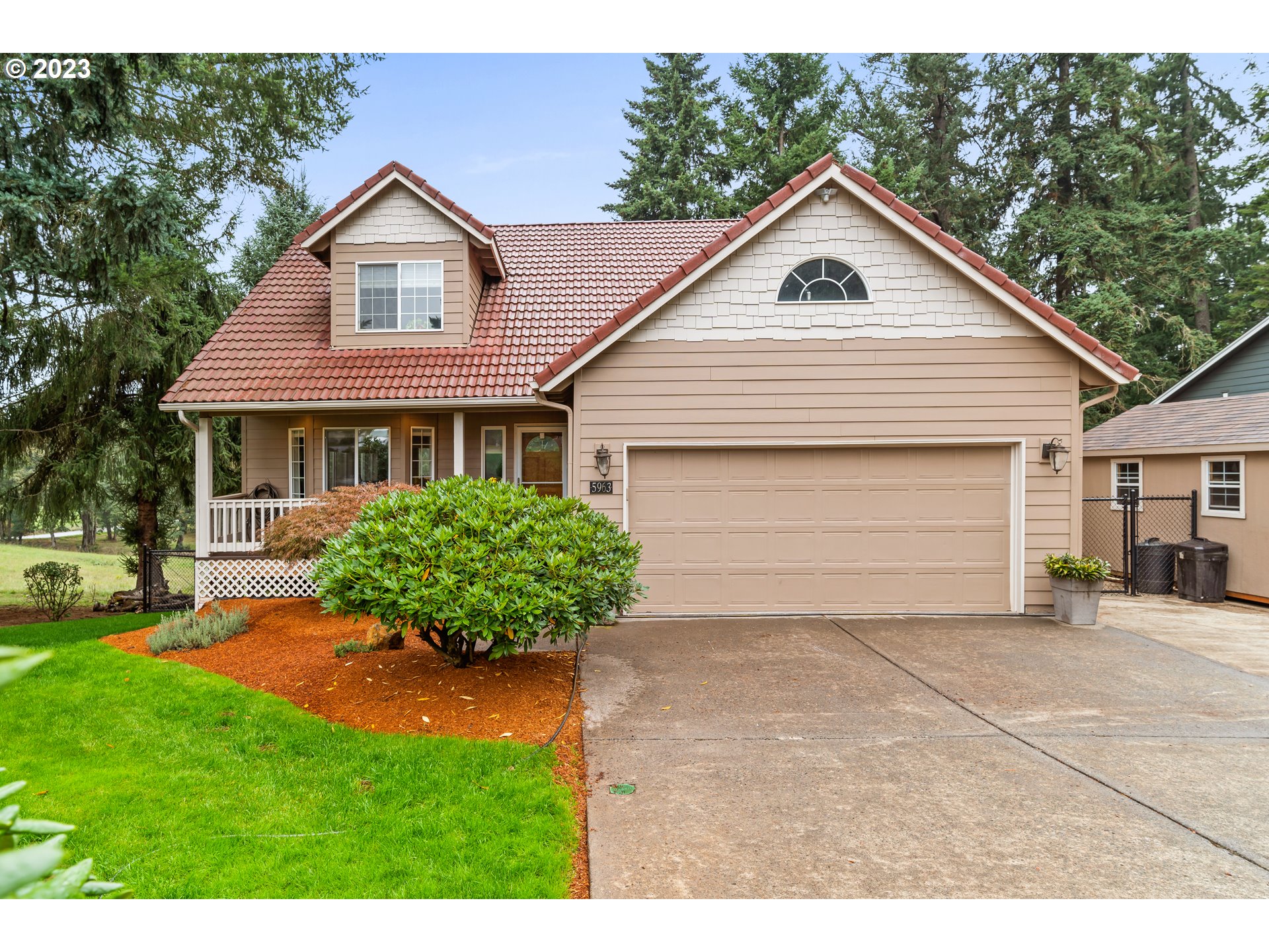 5963 Timber Ridge Drive Southeast Salem, OR 97317 - Photo 6 of 39 a front view of a house with a yard and garage