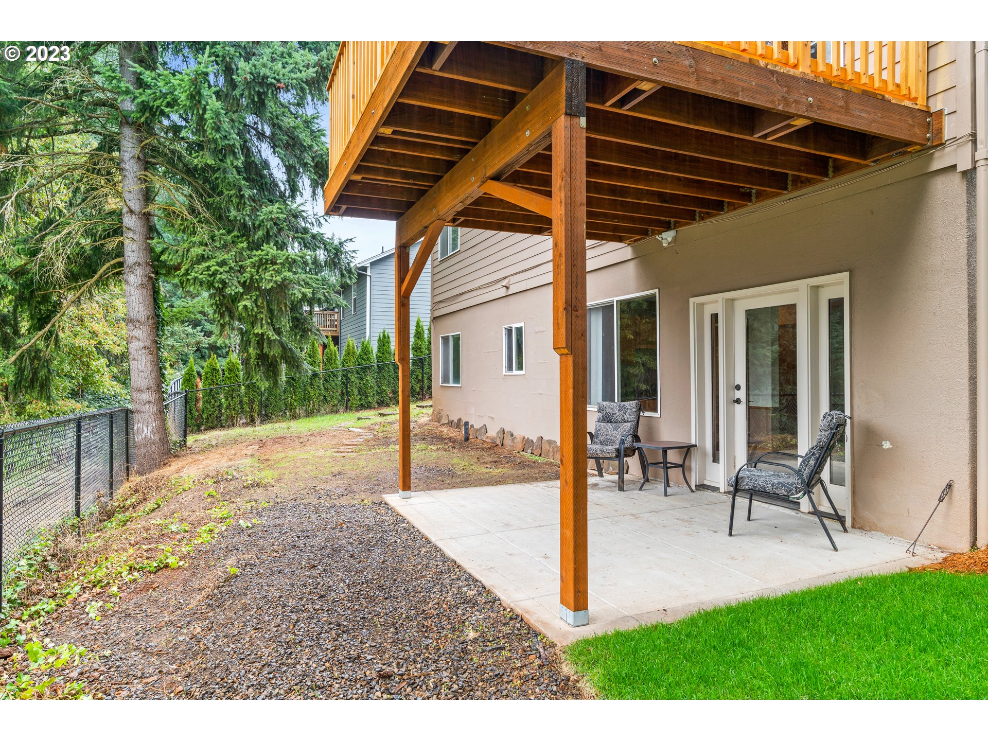 5963 Timber Ridge Drive Southeast Salem, OR 97317 - Photo 8 of 39 a backyard of a house with table and chairs