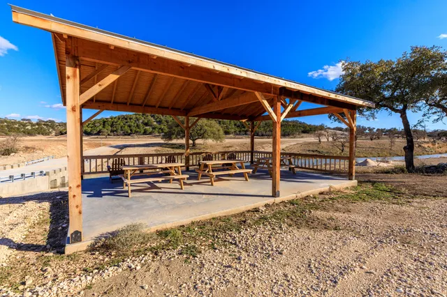 a view of a lake in between two of trees