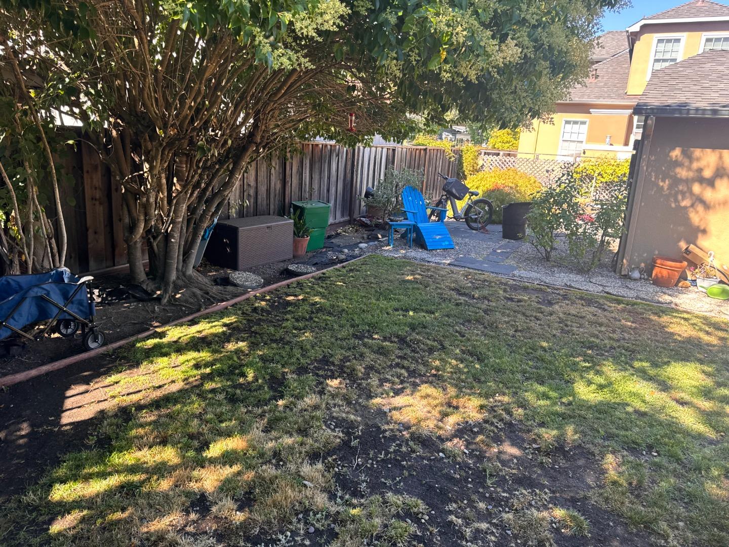 43 B Grand Boulevard, Unit 45B San Mateo, CA 94401 - Photo 11 of 11 a view of a backyard with table and chairs and potted plants