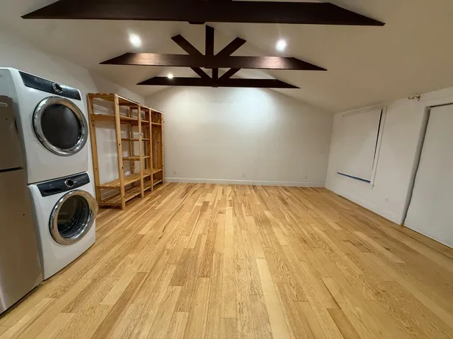 a view of a storage & utility room with wooden floor