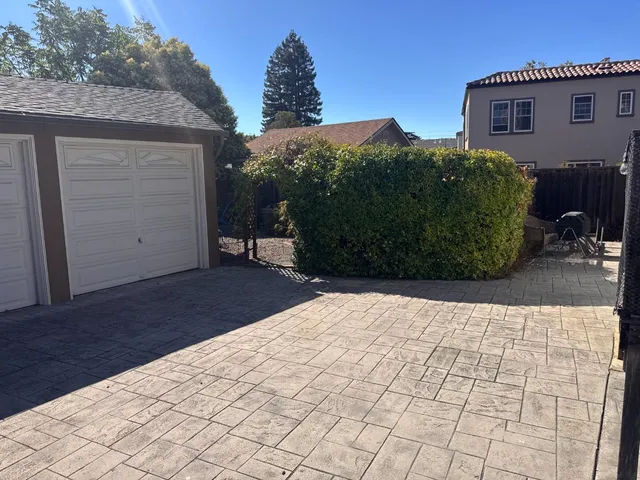 a view of a backyard of the house