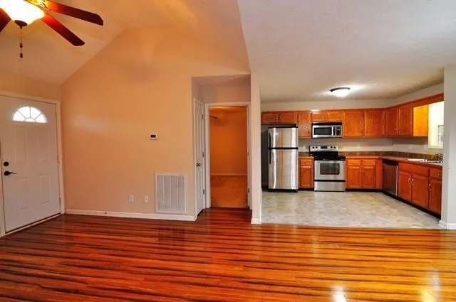 a view of kitchen and wooden floor