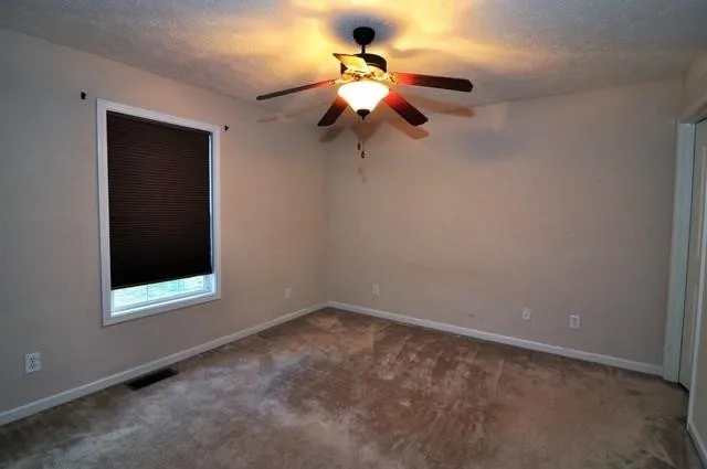 a view of a small space with a fan