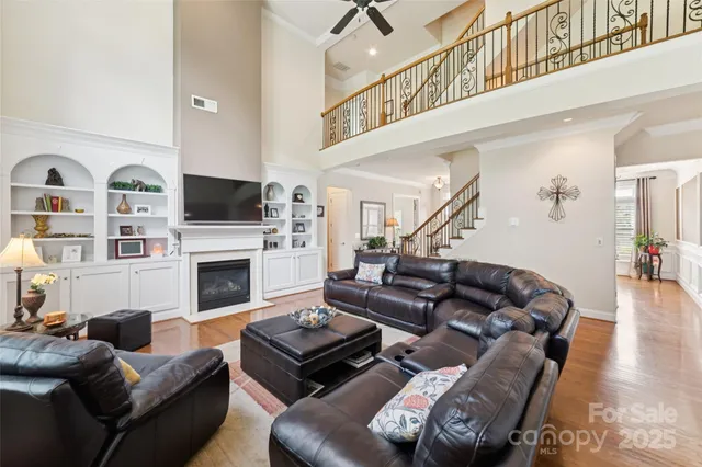 a living room with furniture fireplace and a flat screen tv