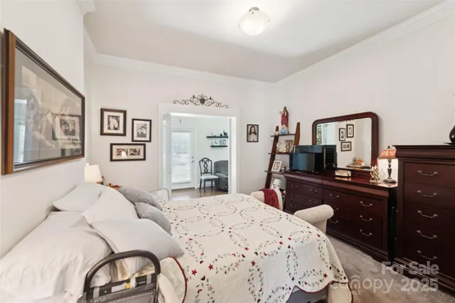 a bed room with a bed and a television