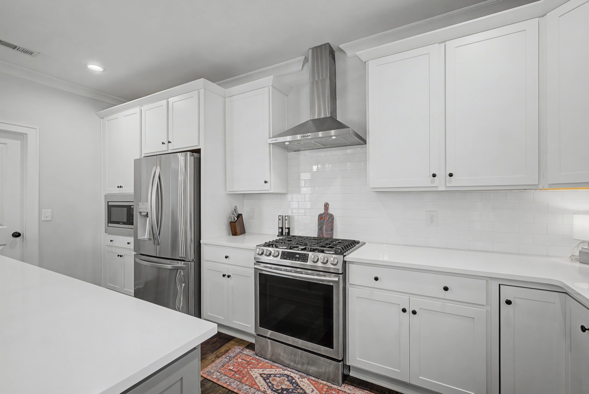 837 Plowson Road Mount Juliet, TN 37122 - Photo 14 of 44 a kitchen with stainless steel appliances a refrigerator stove and white cabinets