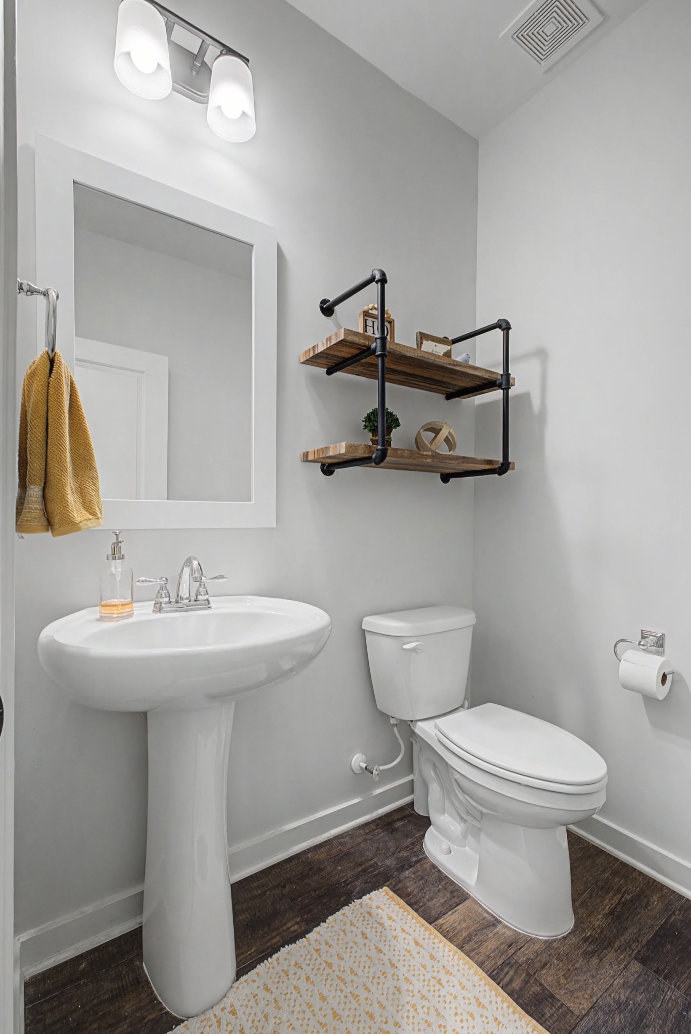 837 Plowson Road Mount Juliet, TN 37122 - Photo 17 of 44 a bathroom with a toilet sink and mirror