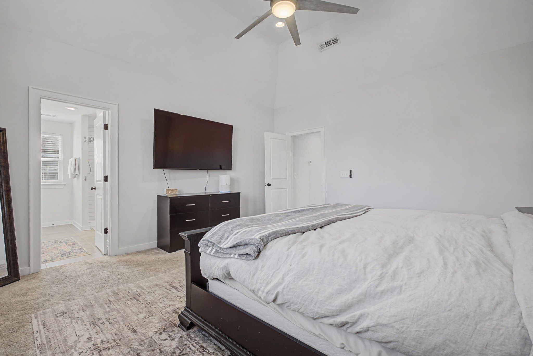 837 Plowson Road Mount Juliet, TN 37122 - Photo 20 of 44 a bedroom with a bed and a flat screen tv
