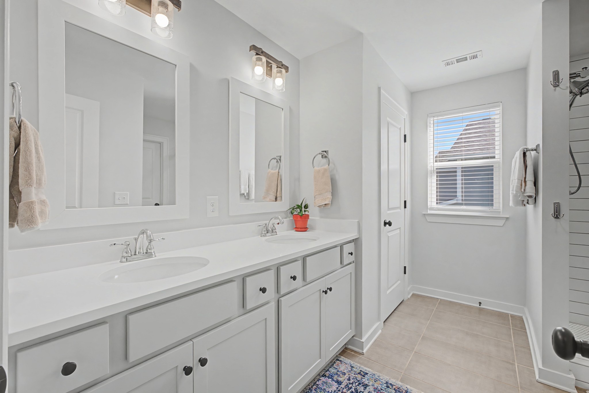 837 Plowson Road Mount Juliet, TN 37122 - Photo 21 of 44 a bathroom with a sink and a mirror