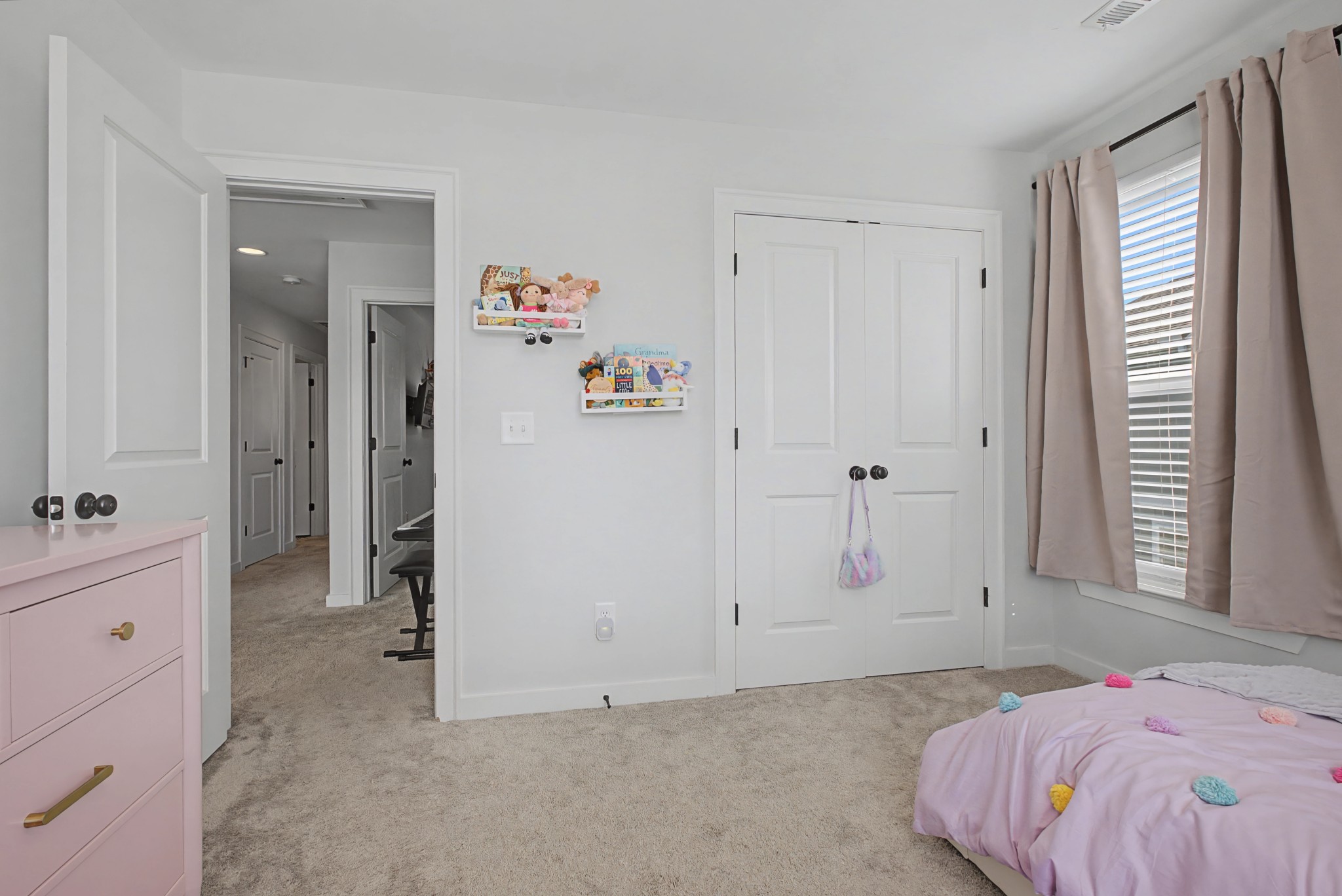 837 Plowson Road Mount Juliet, TN 37122 - Photo 24 of 44 a bedroom with a bed and a window