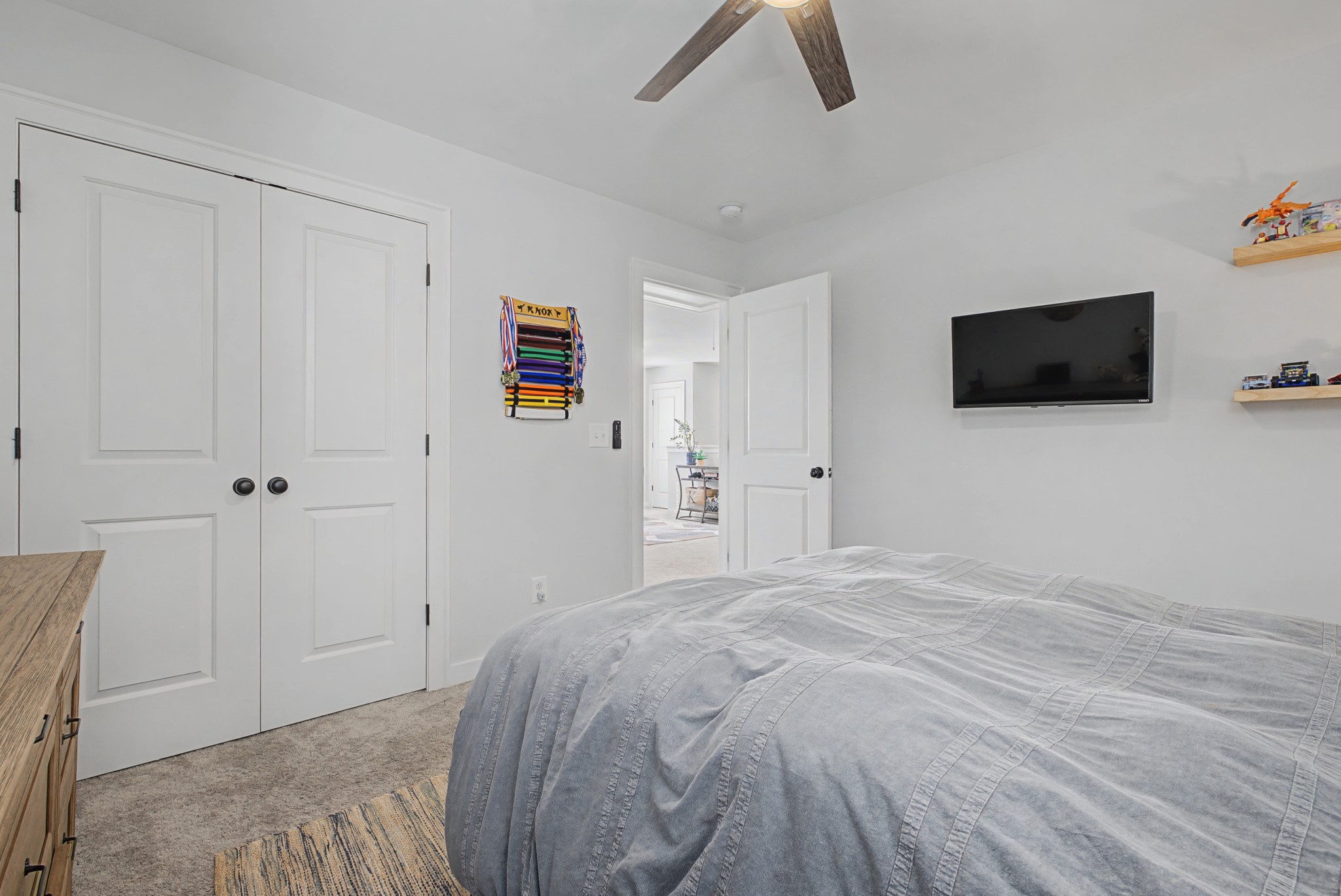 837 Plowson Road Mount Juliet, TN 37122 - Photo 26 of 44 a bedroom with a bed and a flat screen tv