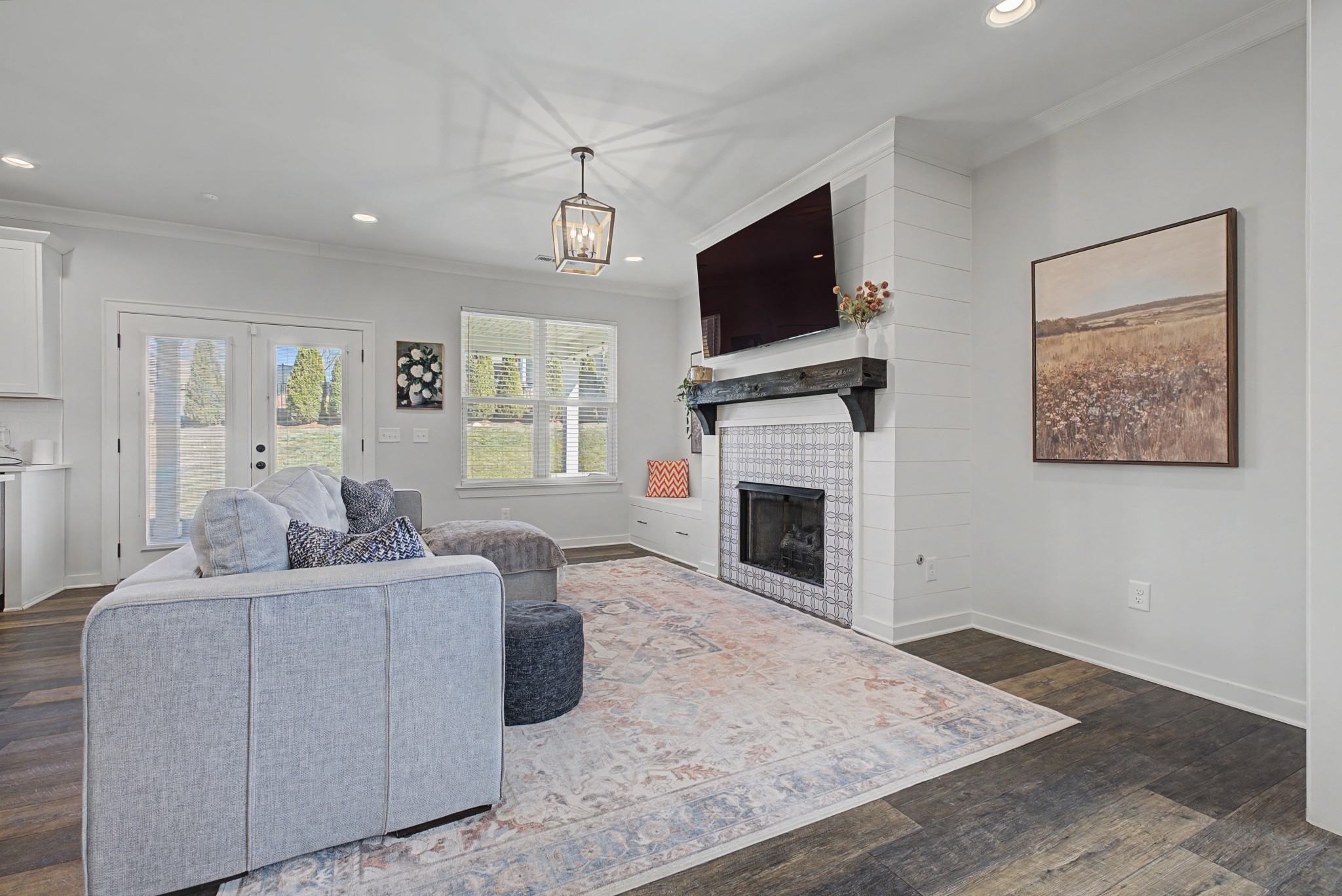 837 Plowson Road Mount Juliet, TN 37122 - Photo 7 of 44 a living room with furniture a fireplace and a flat screen tv