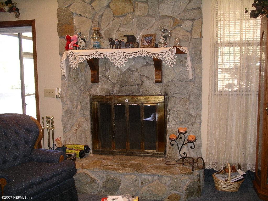 10023 Sandler Road Jacksonville, FL 32222 - Photo 8 of 16 Stone Fireplace