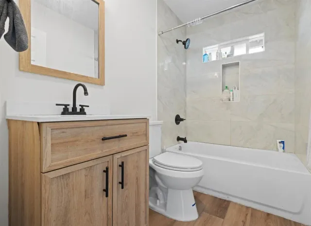 a bathroom with a sink toilet and shower